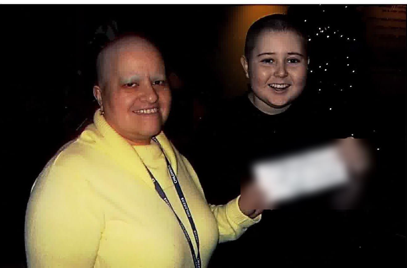 A young scholarship recipient receiving a check from a GameChanger Child Life partner.